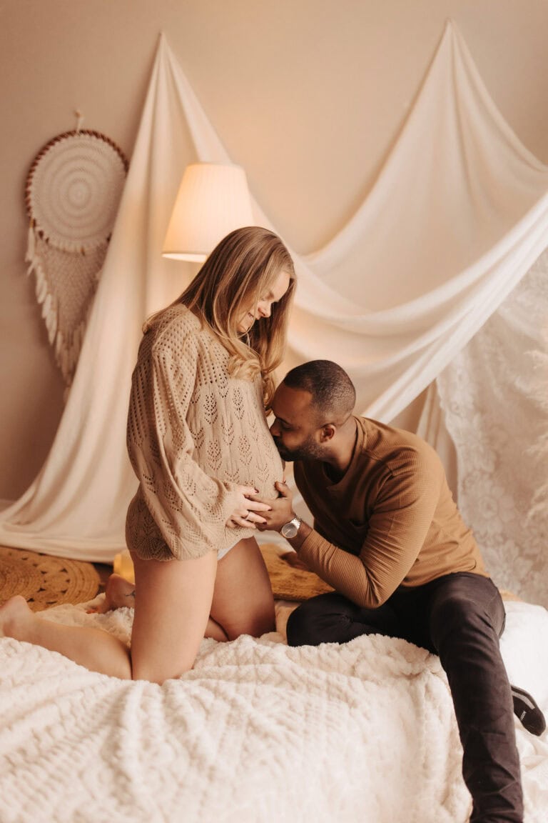maternity session dad kissing the belly